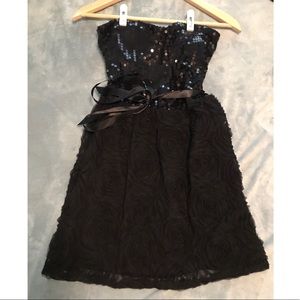 Black dress with sequin top and rosette tulle
